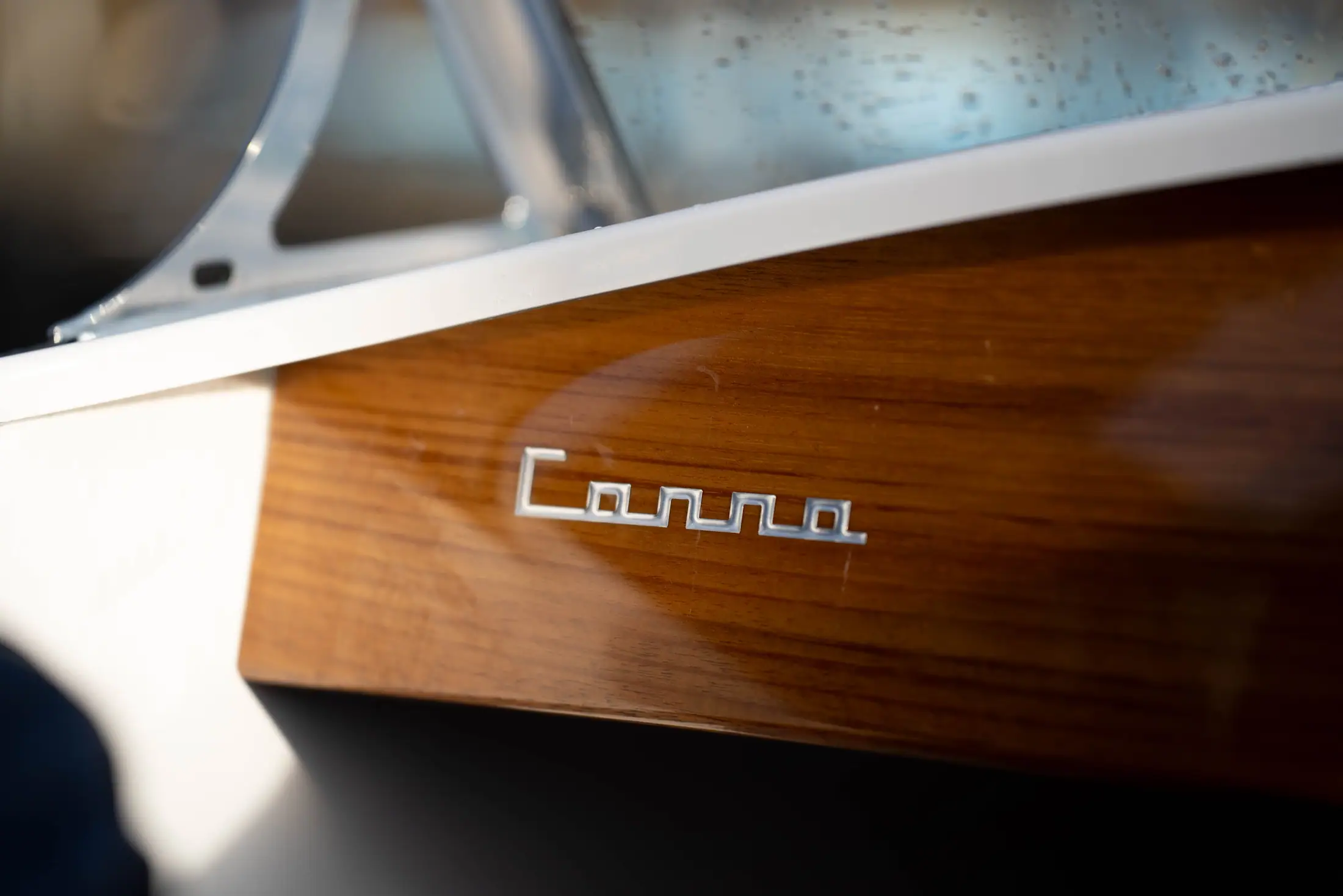 Wood detailing and Canna One emblem on a neo-retro dayboat