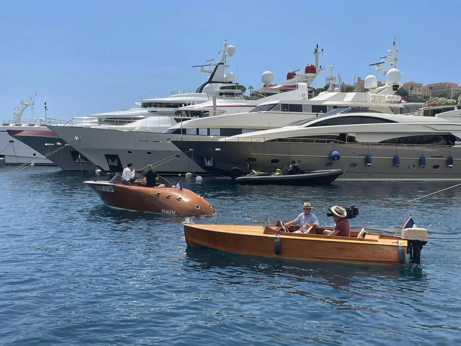 Classic wooden runabout moored in a harbour